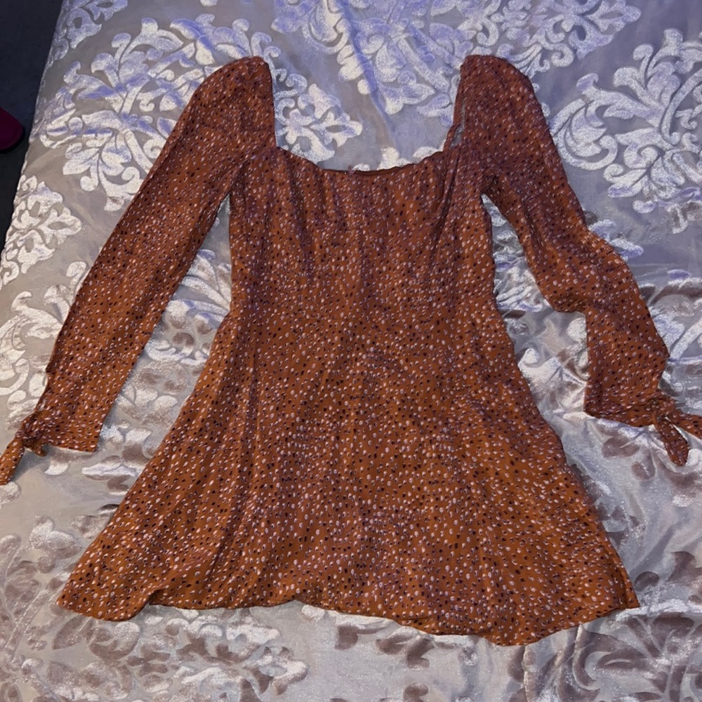 Burnt orange mini dress with shoulder puff and flared skirt